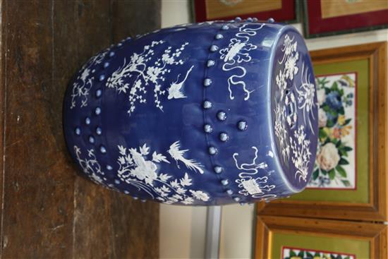 A Chinese blue ground white slip decorated barrel shaped garden seat, late 19th century, 46.5cm